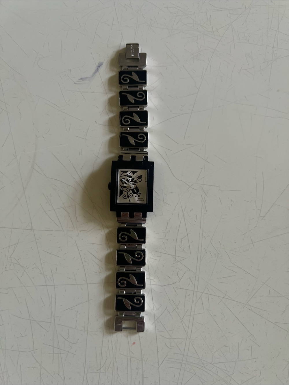 Swatch Black and Silver Floral-Accent Bracelet Watch no battery